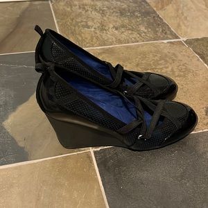 Black wedge shoe. Very comfy never worn outside! New shoe.
